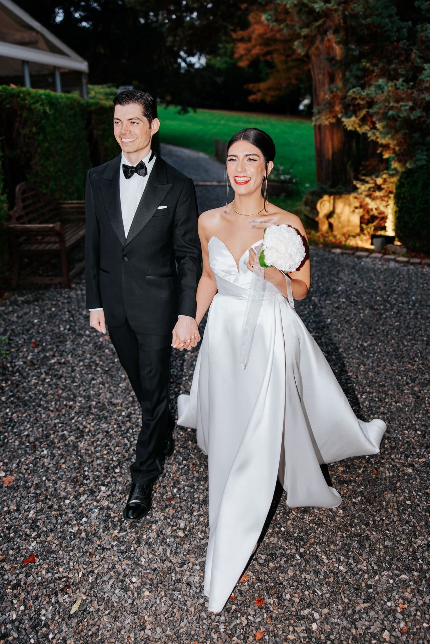 Persian bride and groom walking at twilight — destination wedding venue