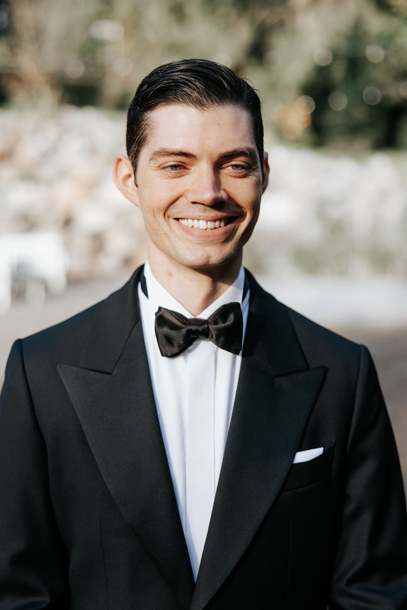 Persian wedding groom portrait in black bow tie — destination wedding